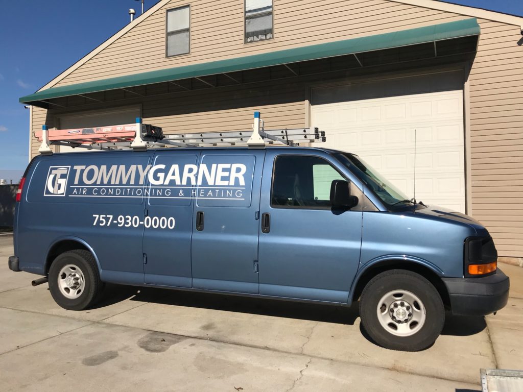 Tommy Garner van in front of garage